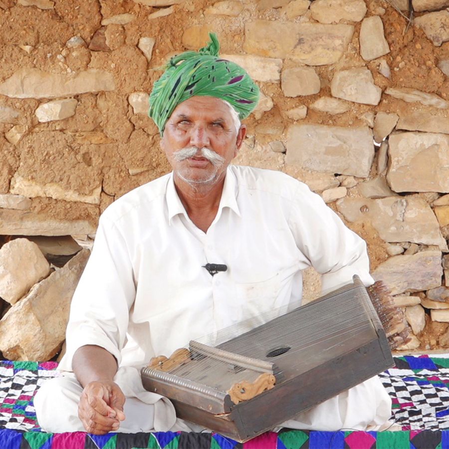 Chanan Khan playing the surmandal