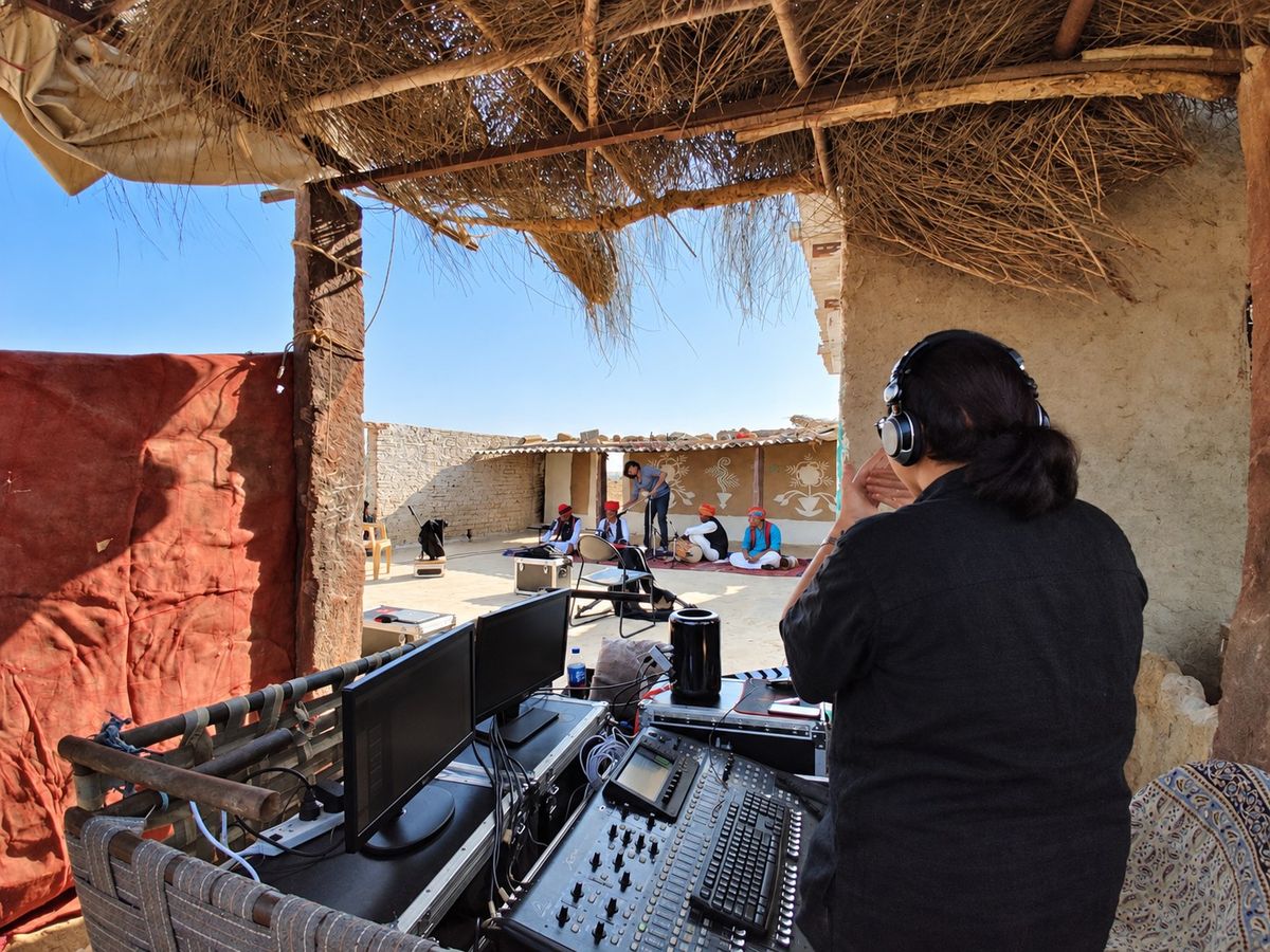 Sound engineer monitoring a live field recording session